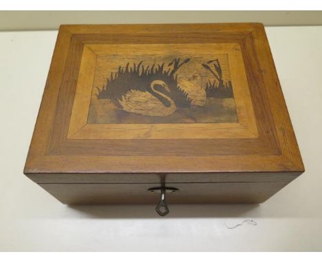 A well made jewellery box containing a vintage music drum playing six different tunes, the box inlaid with swans, 12cm tall x