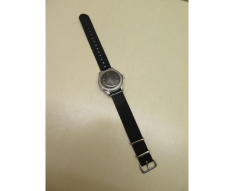 A Cyma WWW military manual wind wristwatch, one of the Dirty Dozen military watches, dust cover with new black Nato strap, no