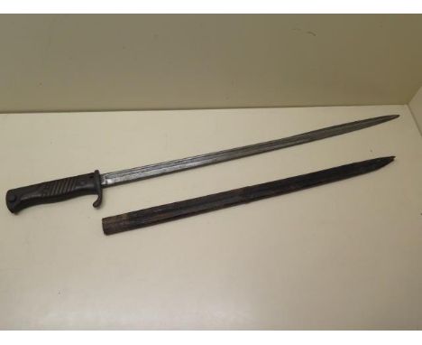 An 1898 German bayonet with leather scabbard, general pitting and age related wear, blade length 52cm 