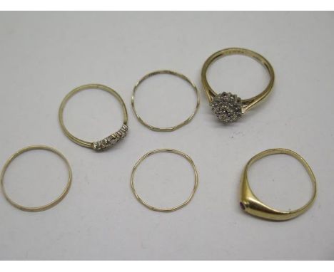 Five 9ct dress rings, sizes H to K, approx 3.3 grams and a gold ring tests to approx 18ct, approx 2.3 grams 