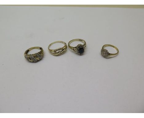 An 18ct gold ring, approx 2.6 grams, size K, and three 9ct dress rings, approx 8.4 grams 