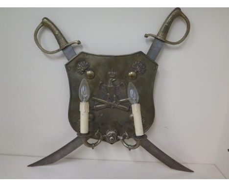 An Italian artillary shield and sword wall lamp, 54cm x 62cm 