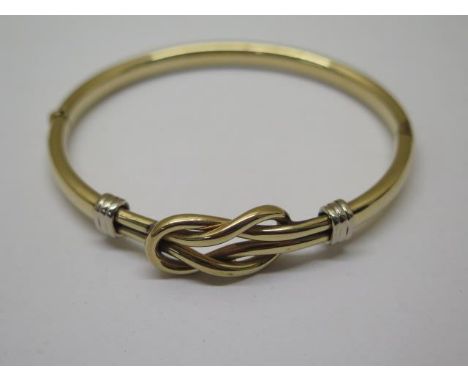 A 9ct gold hinged bangle, 7cm x 6cm external, approx 13.7 grams, in good condition and clasp working 