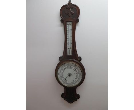 An oak barometer with thermometer, 82cm tall 