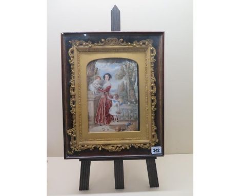 A finely painted watercolour of a beautiful young lady and her two children, signed E J Carillo, in a gilt ornate frame mount