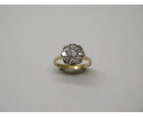 An 18ct gold 9 stone diamond cluster ring, size K/L, approx 2.6 grams, head approx 10mm, diamonds bright and generally good c