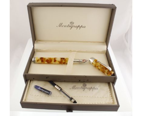 An Italian MONTEGRAPPA amber mounted fountain pen with original box, guarantee & ink resevoir