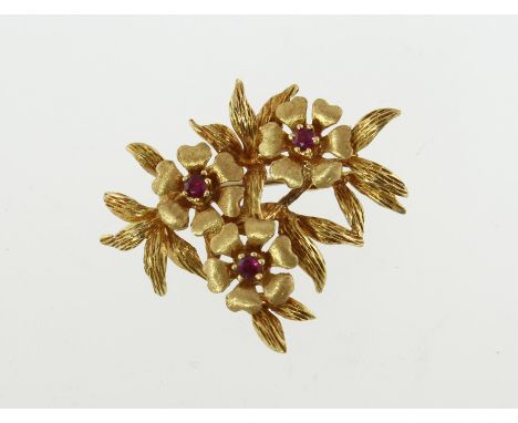 An 18ct H/M ruby set floral brooch, approx 10.3gms