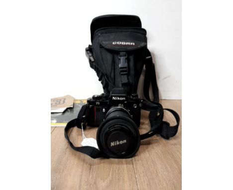 A NIKON F3 CAMERA IN BAG