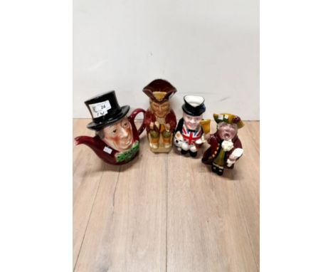 A MAD HATTER TEAPOT AN THREE TOBY JUGS INCLUDING THE TOWN CRIER ETC