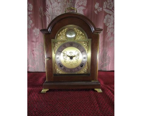 C20th bracket clock, arched top walnut case with brass handle and bracket feet, arched brass dial with silvered Roman chapter