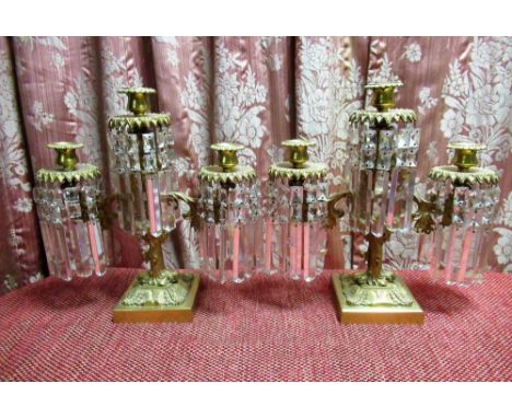 Pair of Regency style cast gilt metal three light candelabra, the twin leaf cast branches with urn sconces on naturalistic su