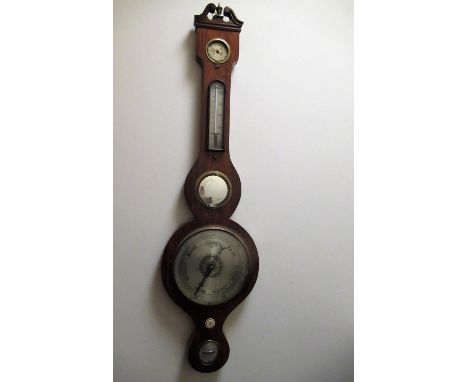 C19th rosewood wheel barometer/thermometer, swan necked pediment with brass urn finial above four silvered dials, convex mirr