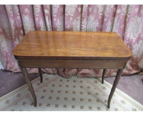 Regency mahogany tea table, the rounded rectangular top outlined with ebonised stringing, on double gate action faux bamboo t