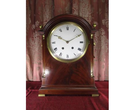 C20th arched top bracket clock, mahogany case with column angles,  brass finials, handles, grilles and feet, white enamel con