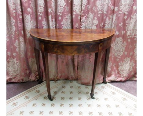 Geo. III satin wood crossbanded mahogany folding D shaped card table, on double gate action square tapered supports with flor
