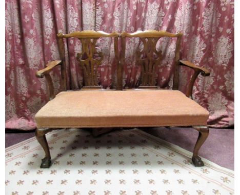 Chippendale style mahogany double chair back settee, with scroll carved cresting and pierced vase shaped splats, outscrolled 