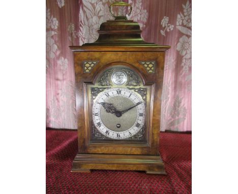 C20th bracket timepiece, figured walnut caddy top case with brass handle, arched brass dial with silvered Roman chapter and A
