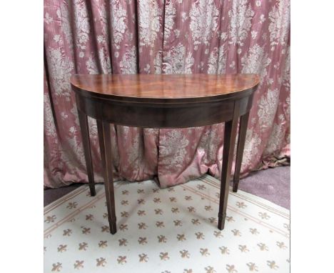 Geo. III rosewood crossbanded mahogany demi lune card table, folding top on double gate action square tapering supports W97cm