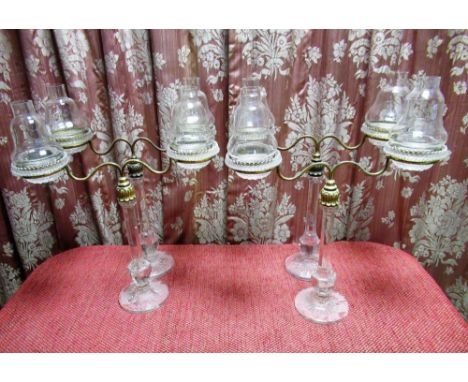 Set of four C20th Clarkes patent Cricklite twin light  table lamps, the brass scroll branches on octagonal tapering columns a
