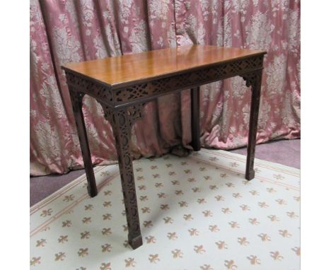 C20th Chippendale style mahogany rectangular silver table with blind fret carved frieze and square supports with pierced core