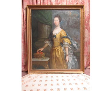 Style of J Woodington (C18th) Three quarter length portrait of a lady standing in yellow dress with blue wrap, oil on canvas,