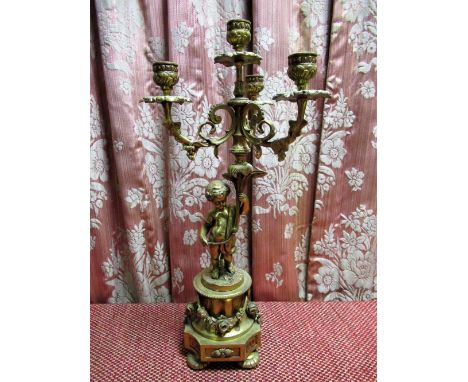 Rococo revival four light candelabra, the three scrolling branches supported by acherub on a floral cast base, later converte