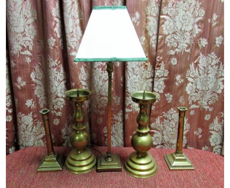 Pair of large brass pricket candlesticks on stepped circular base, pair of late Geo. III brass candlesticks on with gun barre