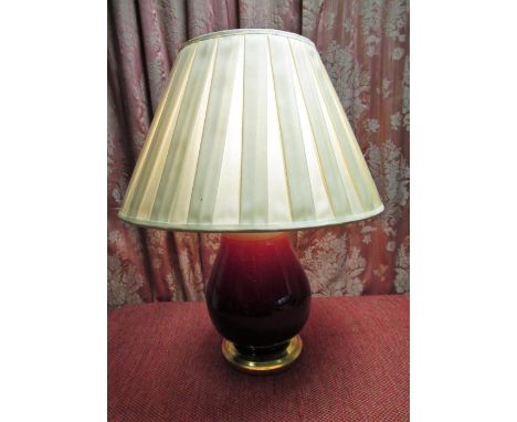 Sang de boeuf table lamp, ovoid body on stepped circular giltwood base with pleated shade, H44cm 