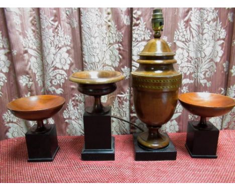 Turned wooden urn shaped table lamp with two chequer bands, and a garniture of three turned wooden tazza, H43cm max, all on e