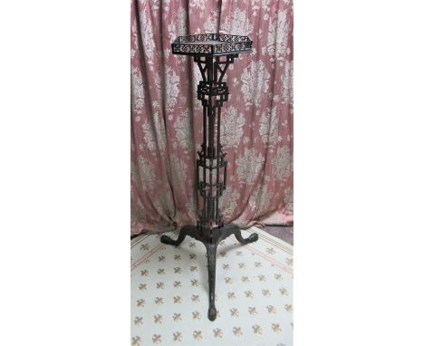 Chinese Chippendale Revival mahogany torchere, the hexagonal top with fretwork gallery on openwork column support with three 