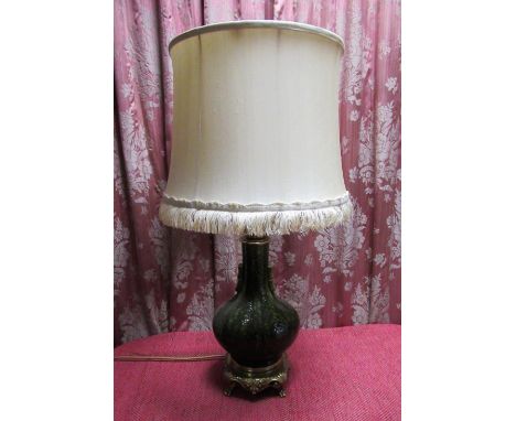 Chinese style table lamp, the green glazed bottle shaped body relief decorated with flowers with two bamboo handles, on cast 