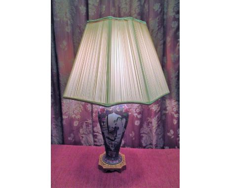 Japanese Canton table lamp, the hexagonal tapering body decorated with figures in garden landscapes in reserve panels, on a l