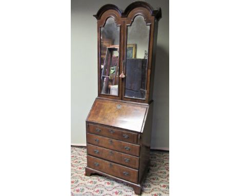 Small Queen Anne's style herring banded walnut double dome topped bureau bookcase with two mirrored doors enclosing adjustabl