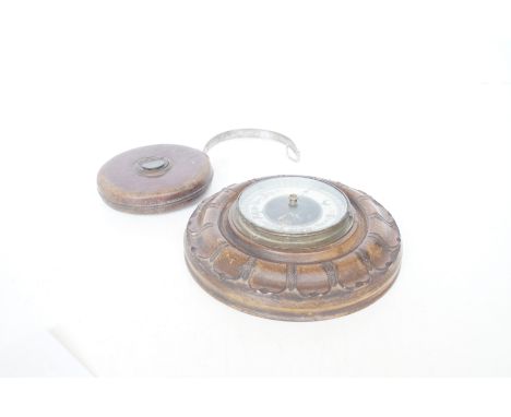 Wall barometer together with a vintage metal tape rule 