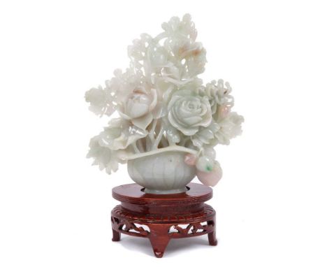 Fine quality modern jade carving, pale celedon stone carved as a vase of flowers, 18cm high, on pierced and carved stand