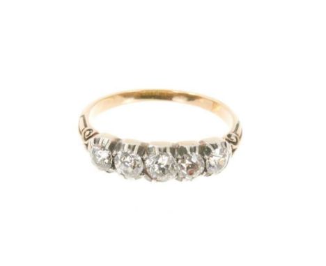 Mid Victorian diamond five stone ring with five old cut diamonds in silver collet setting, carved shoulders on gold shank. Es