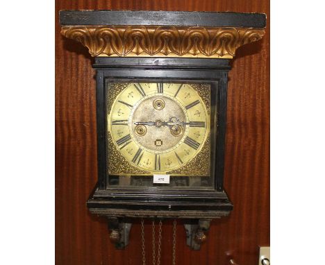 Antique brass dial 30 hour wall clock signed W.Atkinson Malton with gilded ebonised hooded bracket together with pendulum and
