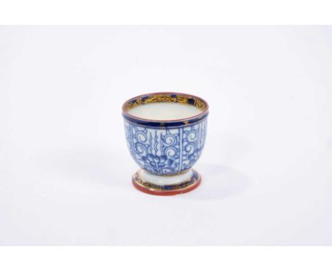 Rare Caughley egg cup, circa 1785, painted in blue with the Lily pattern, gilt highlights, enamel painted rims, and 'S' mark 