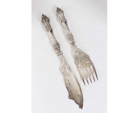 Pair of Victorian silver fish servers with pierced and engraved silver blades and leaf mounted waisted handles, with engraved