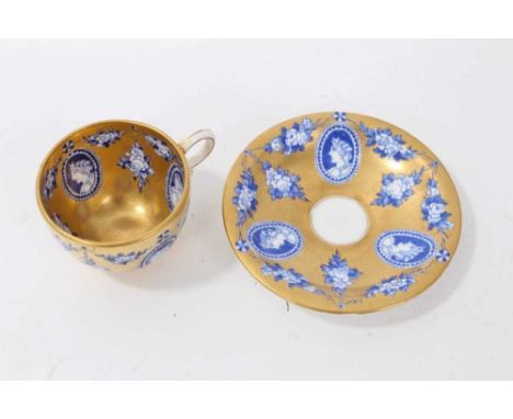 Late 19th century Coalport miniature cup and saucer, decorated with portrait busts on a gilt ground, printed marks to base, s