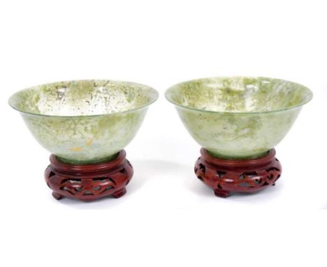 Rare pair of Chinese jade bowls, turned to a transparent degree of fineness, each with everted rim on footed base, 12.5cm dia