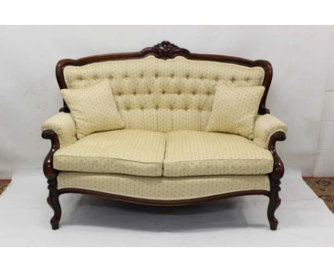 Good quality Victorian style mahogany framed sofa, floral button upholstered bowed back and seat in channel carved showwood f