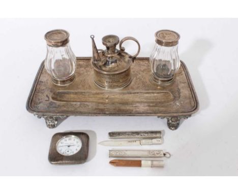Victorian silver ink stand of rectangular form, with raised border, pen well and presentation inscription, on four decorative