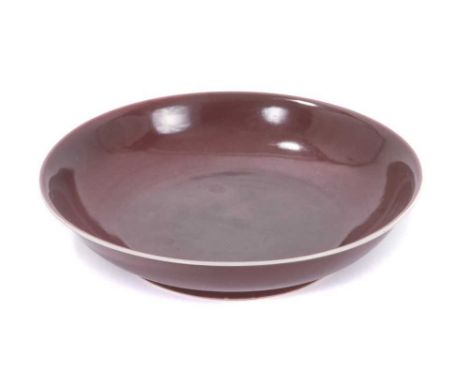 Fine antique Chinese Qing dynasty aubergine glazed saucer dish, finely potted with rounded sides and flared rim, on a short f