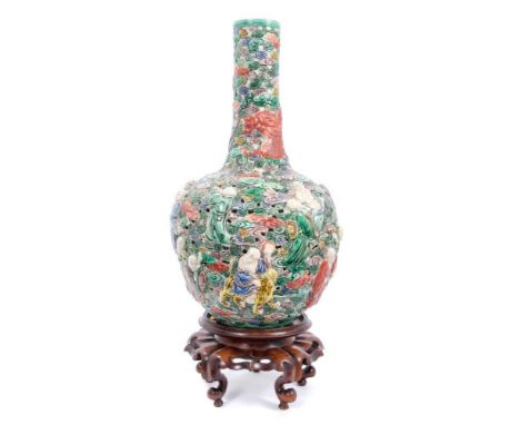 Chinese famille verte reticulated bottle vase, decorated in relief with immortals and a dragon, six character seal mark to ba