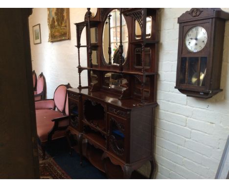 An Edwardian mahogany mirror backed unit with pierce decoration glazed two door cupboard base with cabriole legs