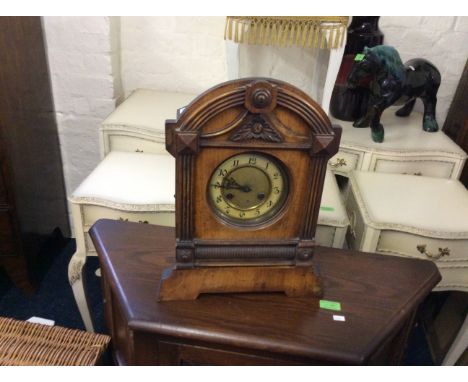 A mahogany Edwardian mantle clock with fluted columns