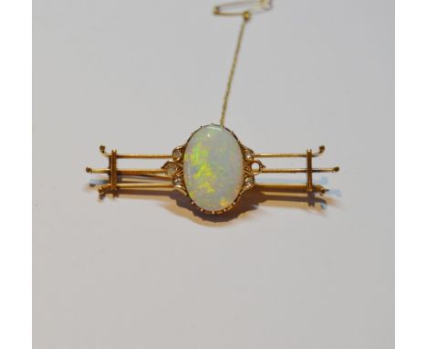 Edwardian gold triple bar brooch with an oval opal and (now) five diamonds, in gold, signed (probably) 'GH Kuster 15ct', poss