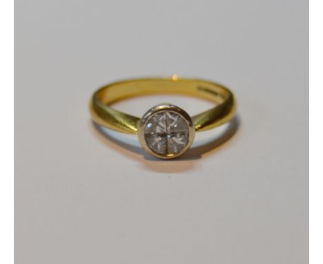 Diamond ring of solitaire style with four princess-cut segments, collet-set, in 18ct gold, size R, 5g gross. 